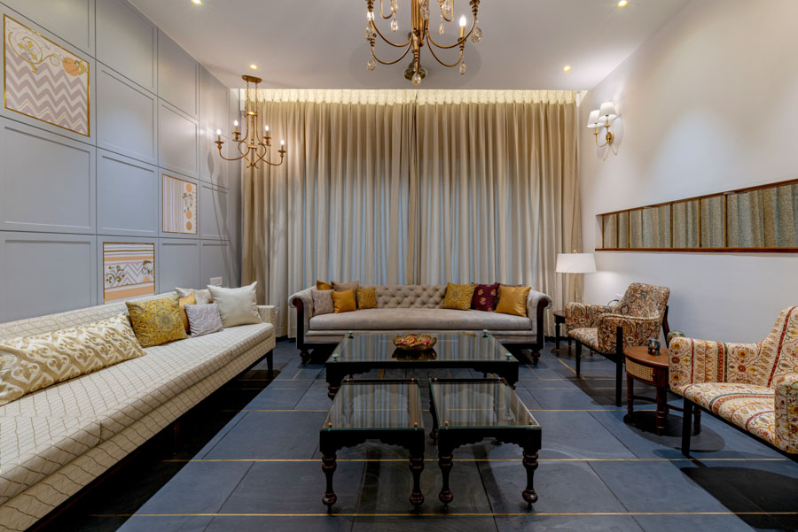 Floor-to-ceiling curtain design in a classy living room, luxurious furniture and golden details