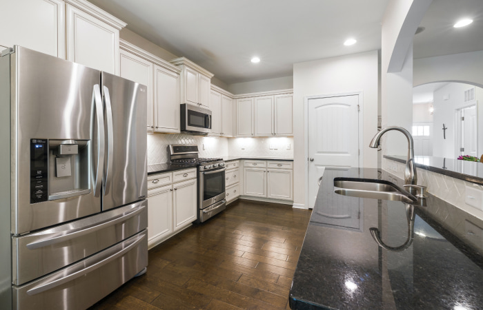 Modular kitchen design with storage space in the kitchen triangle - Beautiful Homes