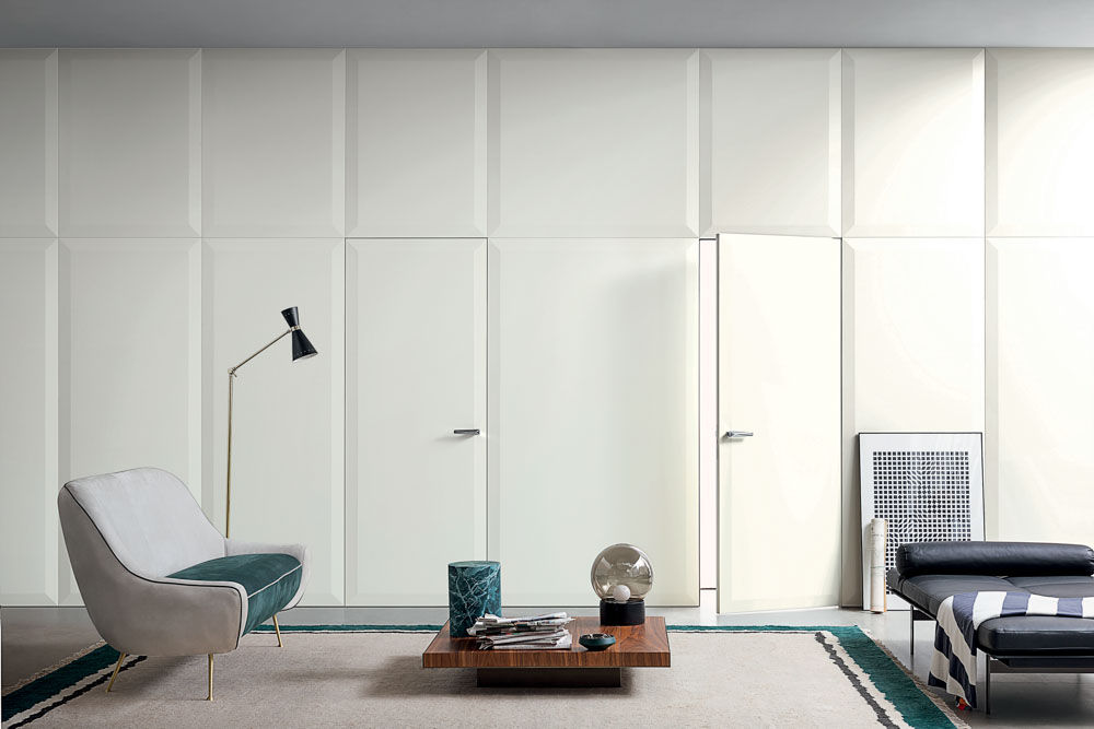 Spacious room design with door design looking like a part of the wall - Beautiful Homes