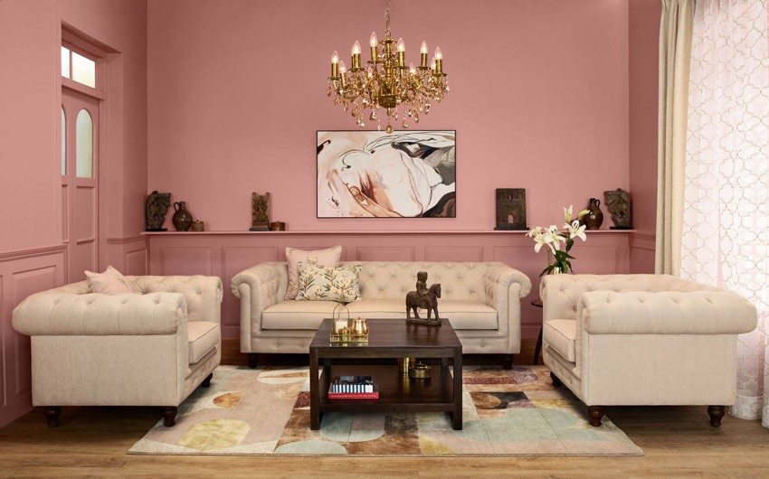 Living room design with wooden furniture, grand chandelier & upholstered sofa set - Beautiful Homes