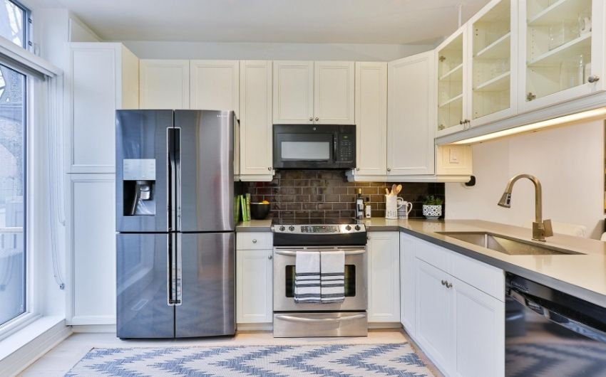 All white L-shaped modular kitchen design layout - Beautiful Homes