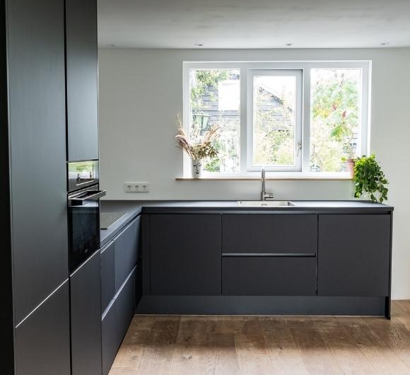 Black & sleek l shaped modular kitchen design layout - Beautiful Homes