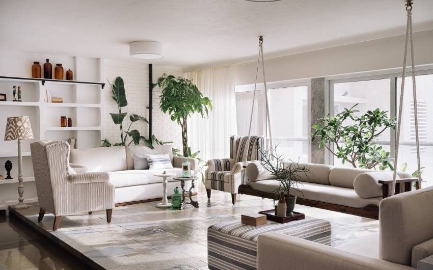 Marble home décor in this living room with marble flooring - Beautiful Homes