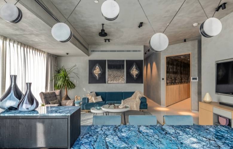 Open living & dining room with marble dining countertop - Beautiful Homes