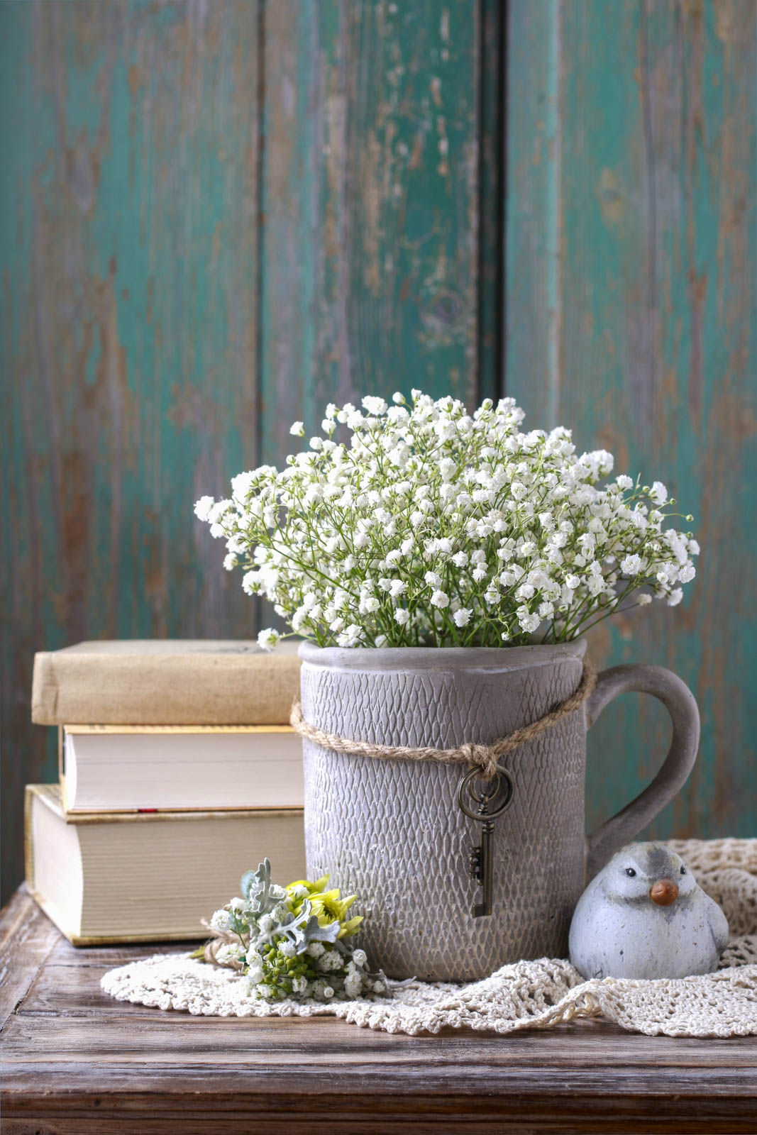 A Bunch of Baby's Breath Stems in a Rustic Clay Jug - Beautiful Homes
