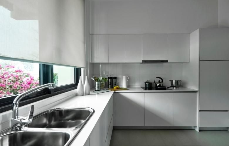 Metallic L-shaped modular kitchen design layout with minimal interiors - Beautiful Homes