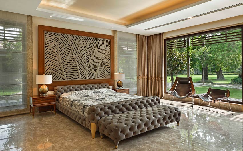 Modern bedroom design with bed that has a tufted upholstery finish matching with bedroom décor - Beautiful Homes