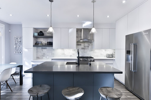 Modular kitchen with acrylic finish kitchen cabinets, monochromatic & blue kitchen colour - Beautiful Homes