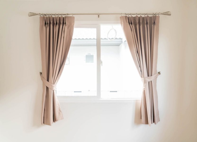 choosing between curtains and drapes