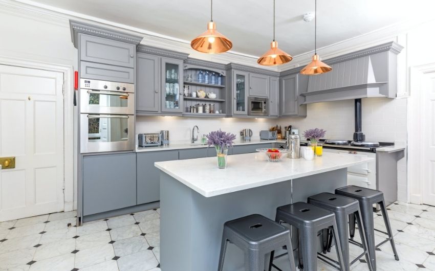 While & grey kitchen interior design with island layout as breakfast counter - Beautiful Homes