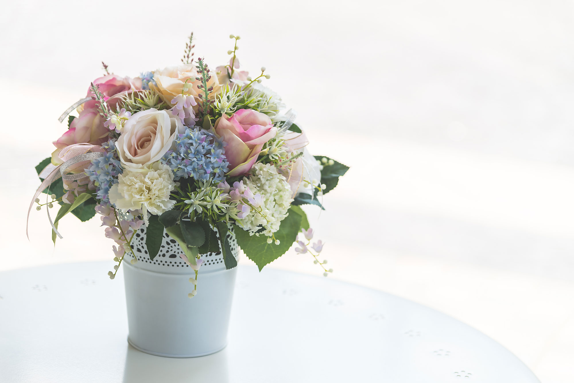 Interesting containers used as vase to hold the flowers - Beautiful Homes