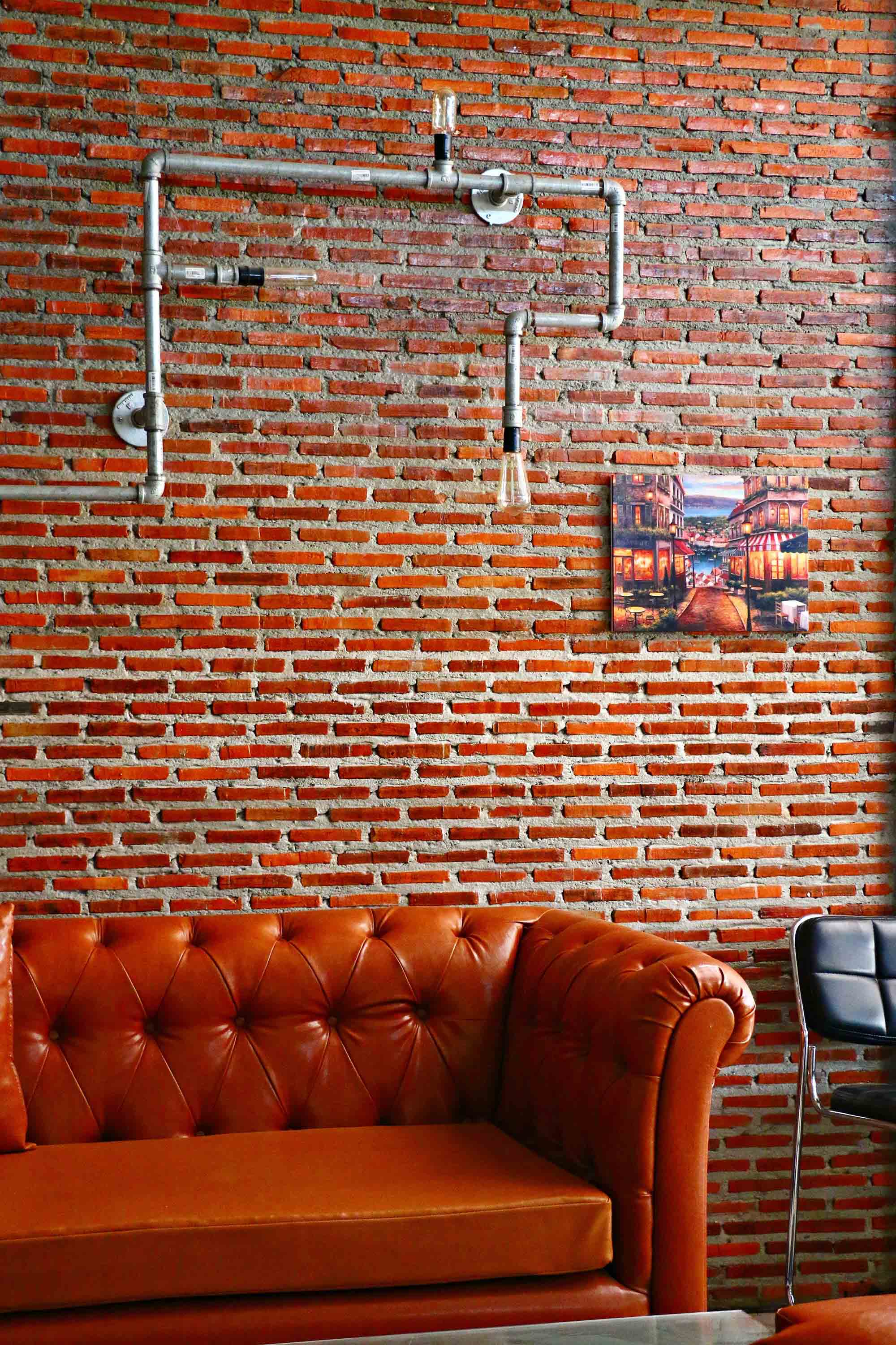 Red brick statement wall effect for home décor - Beautiful Homes