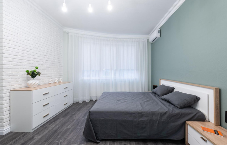 Accent brick wall with hanging ceiling lights - Beautiful Homes