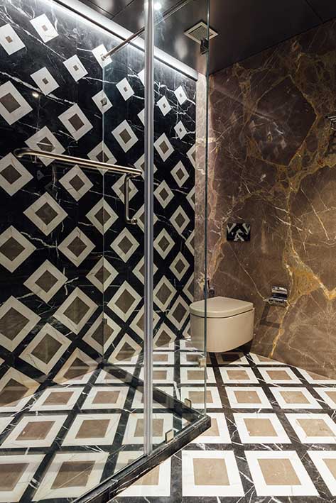 Geometric patterns bathroom design with soft browns for the walls & floors  - Beautiful Homes