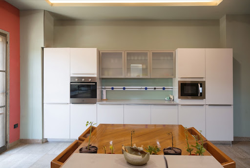 Straight kitchen with tall crockery unit & kitchen storage cabinets - Beautiful Homes