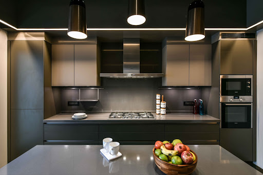Dark modular kitchen design with kitchen tall unit for grocery storage - Beautiful Homes