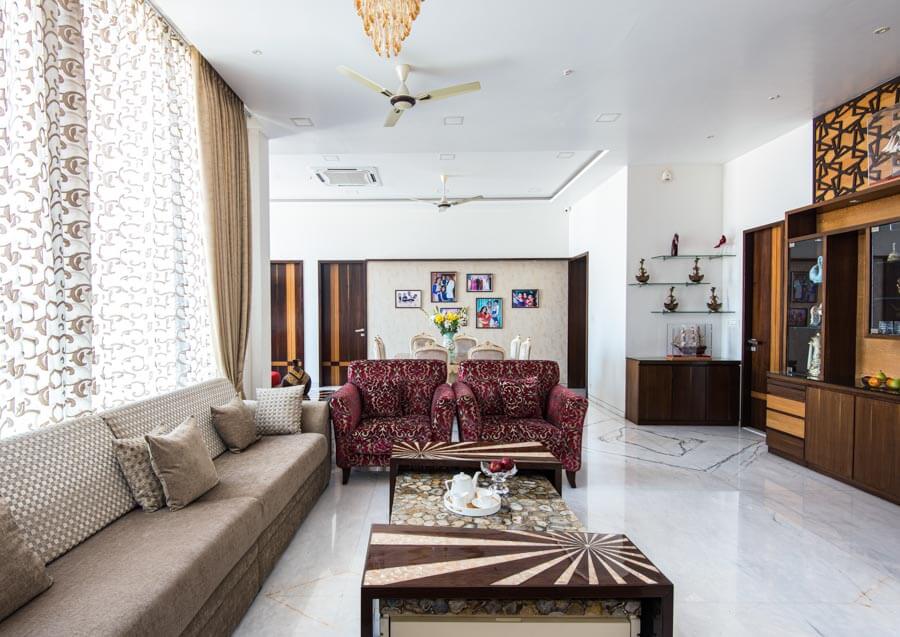 White marble floor design in a busy living room  - Beautiful Homes