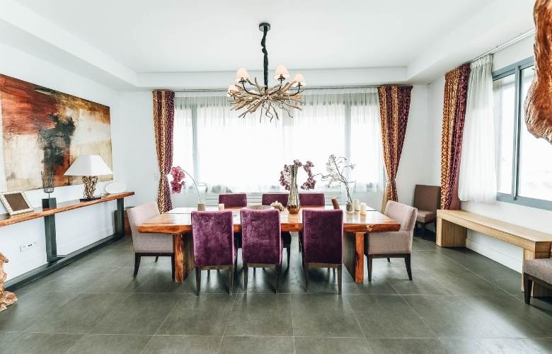 Large dining room design with 8 seater dining table & velvet upholstered chairs - Beautiful Homes