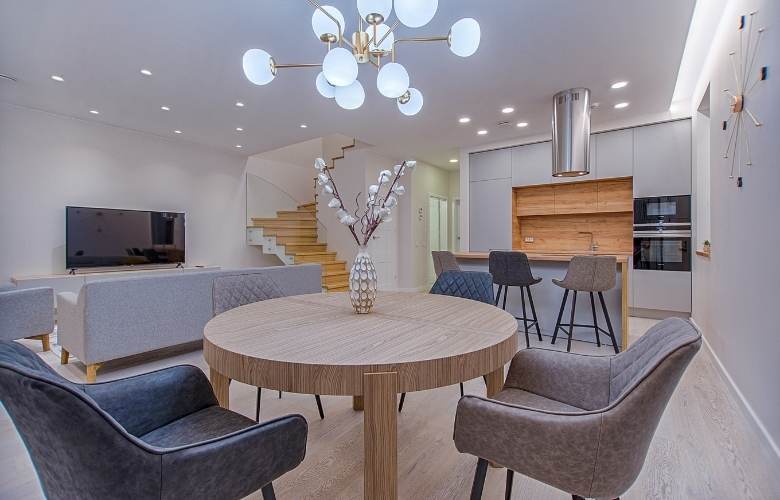 Open living, kitchen & dining room design with wooden interiors - Beautiful Homes