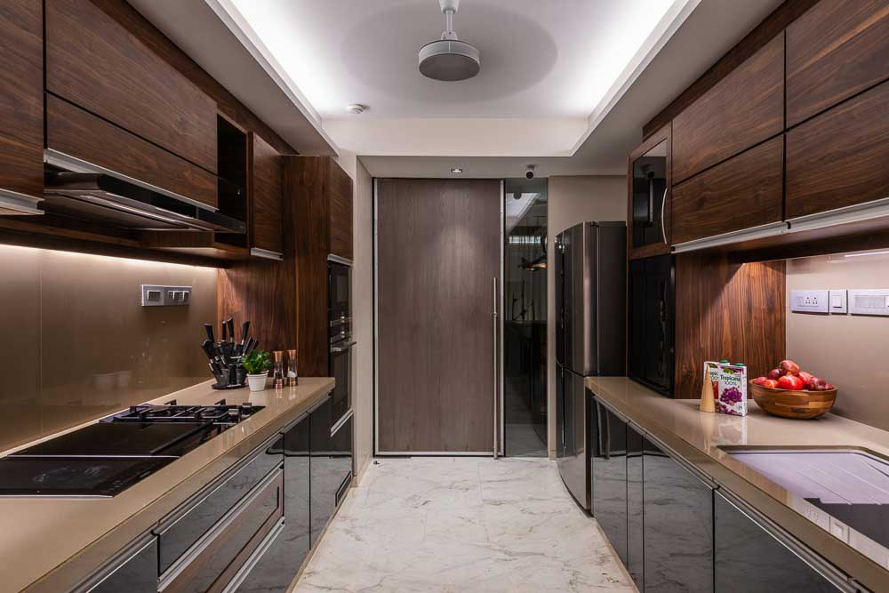 A typical indian modular closed kitchen layout with more work surfaces & private cooking space - Beautiful Homes