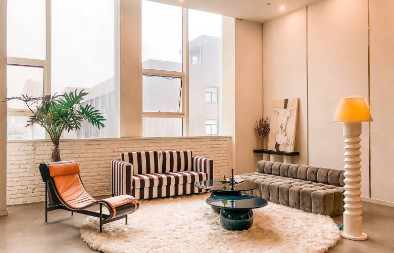 Custom room interiors with brick wall paneling & floor lamp - Beautiful Homes