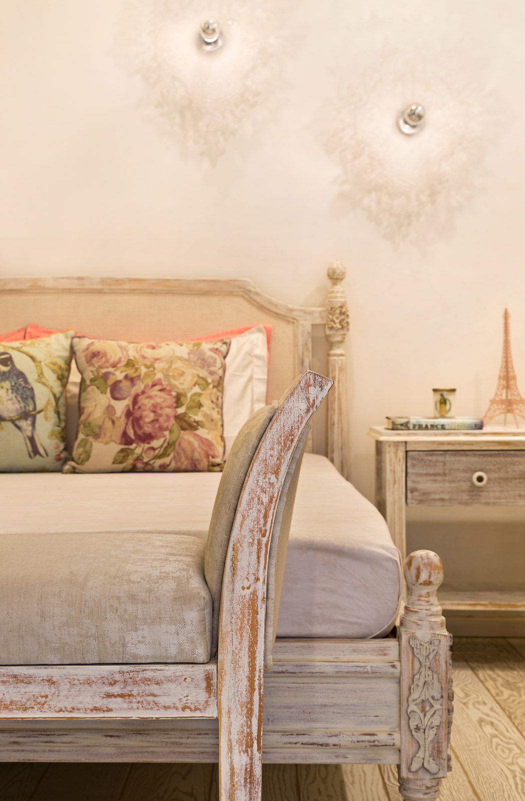 A bed and day bed made from distressed wood creates a vintage look - Beautiful Homes