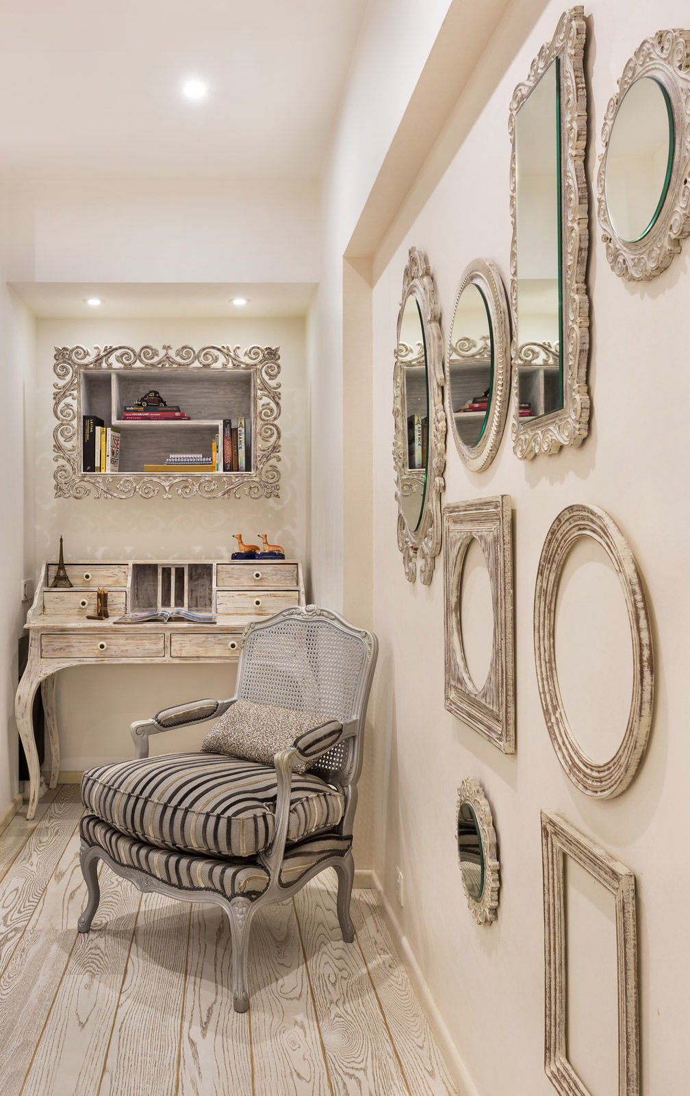 An assortment of frames of different sizes in an earthy penthouse duplex - Beautiful Homes