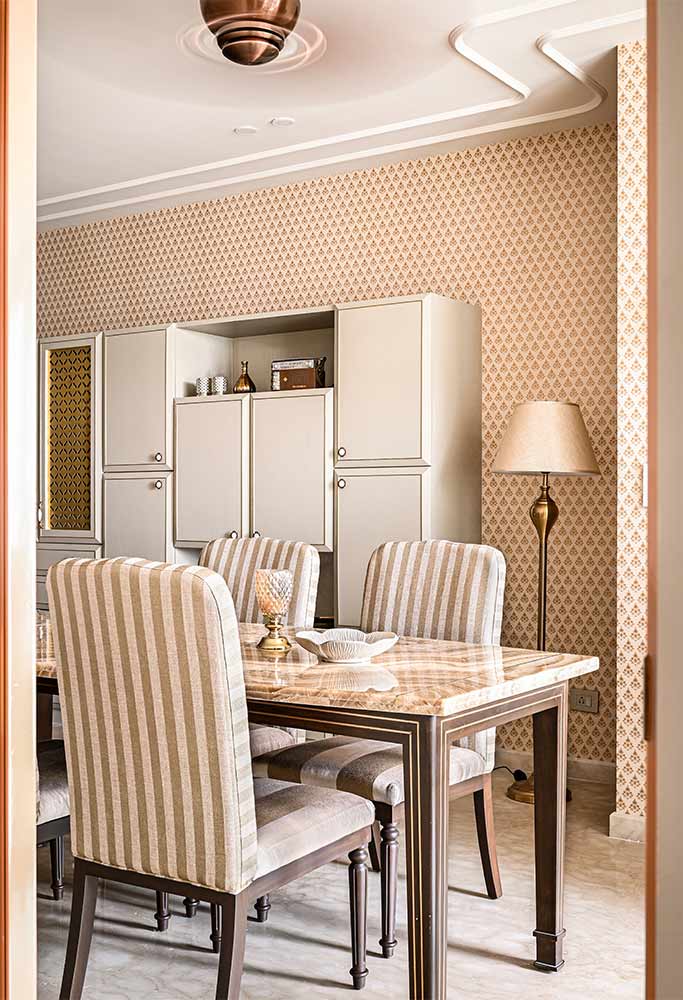Rich textures, a neutral colour palette & regal wall paper makes the dining space simple & elegant - Beautiful Homes
