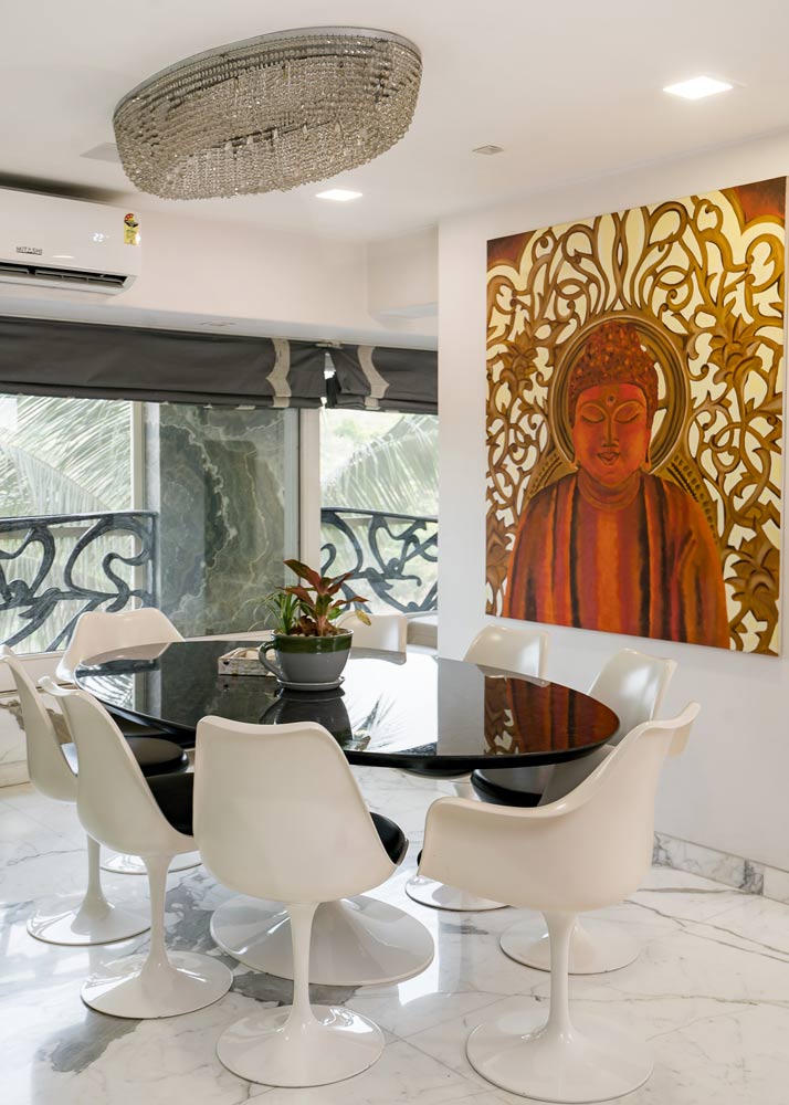 Colourful artwork on the wall works as accent in dining room interior design - Beautiful Homes