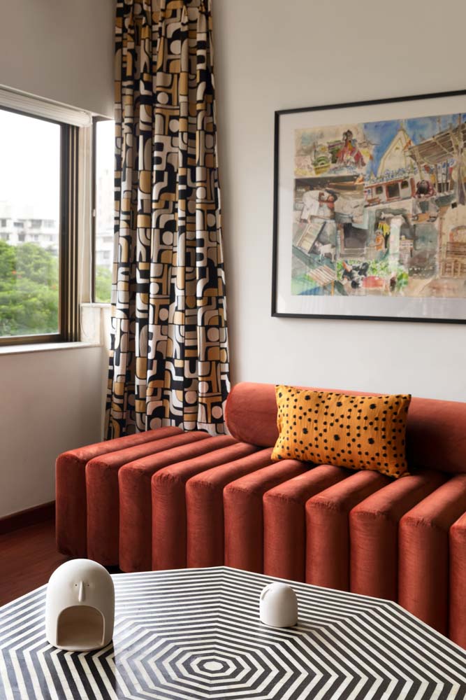 Living room with mock drapes with abstract print fabrics - Beautiful Homes