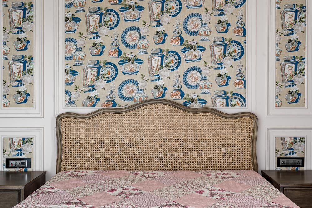 A classic bedroom wallpaper design behind the bed & side tables for perfect bedroom design - Beautiful Homes