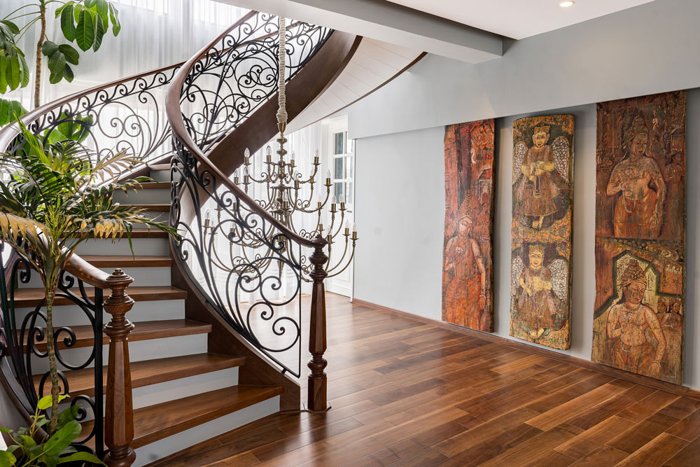 Beautiful house design with supersized wall arts on the wall along the staircase - Beautiful Homes