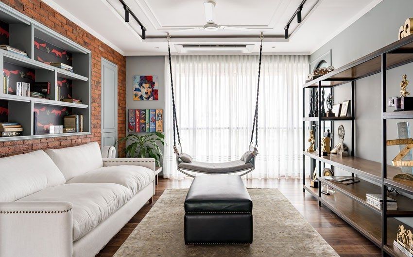 Interesting shelving units stuck on the wall along with a unit with wood & pipes in the living room - Beautiful Homes