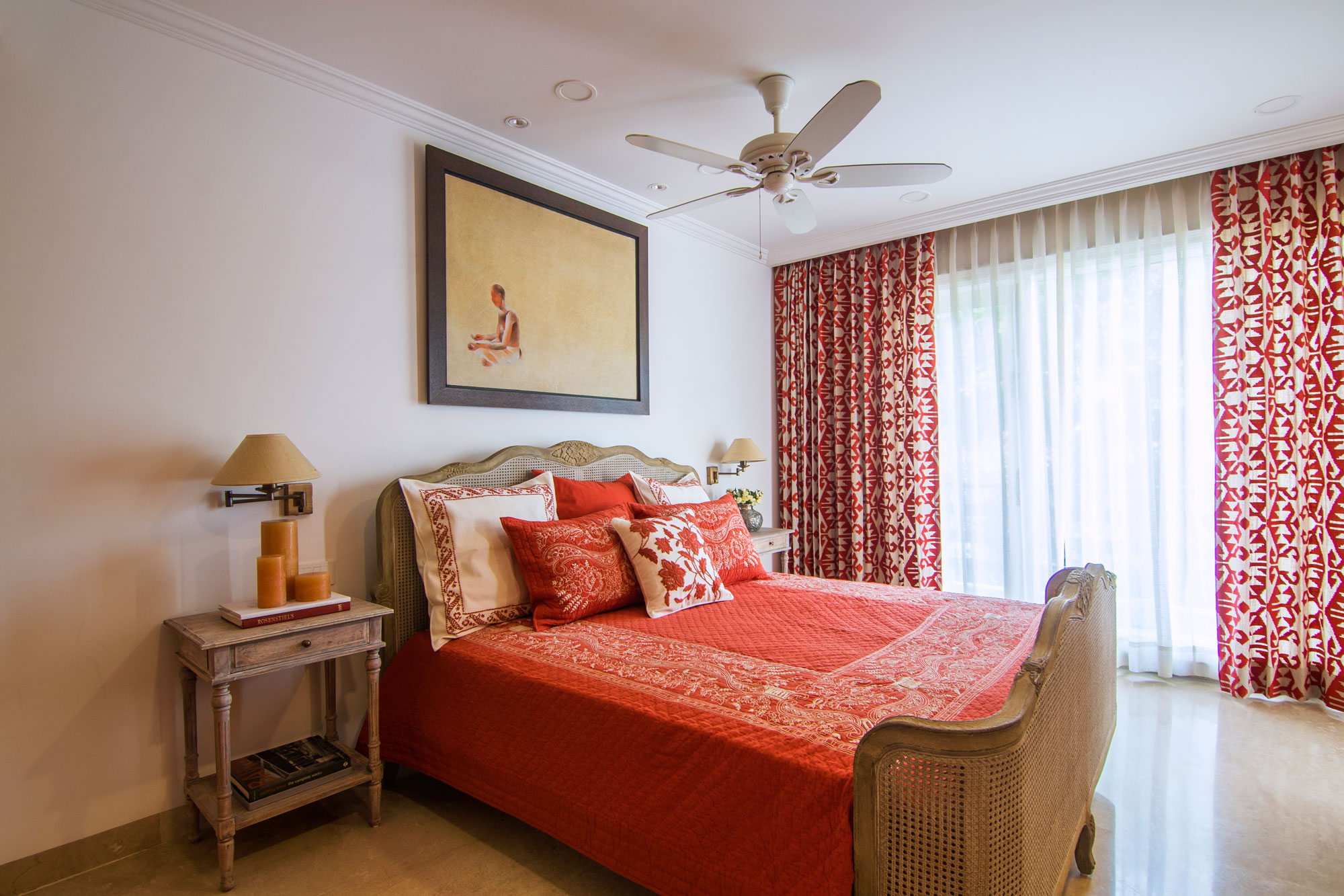 A view of the master bedroom with a cane bed and bed linen - Beautiful Homes