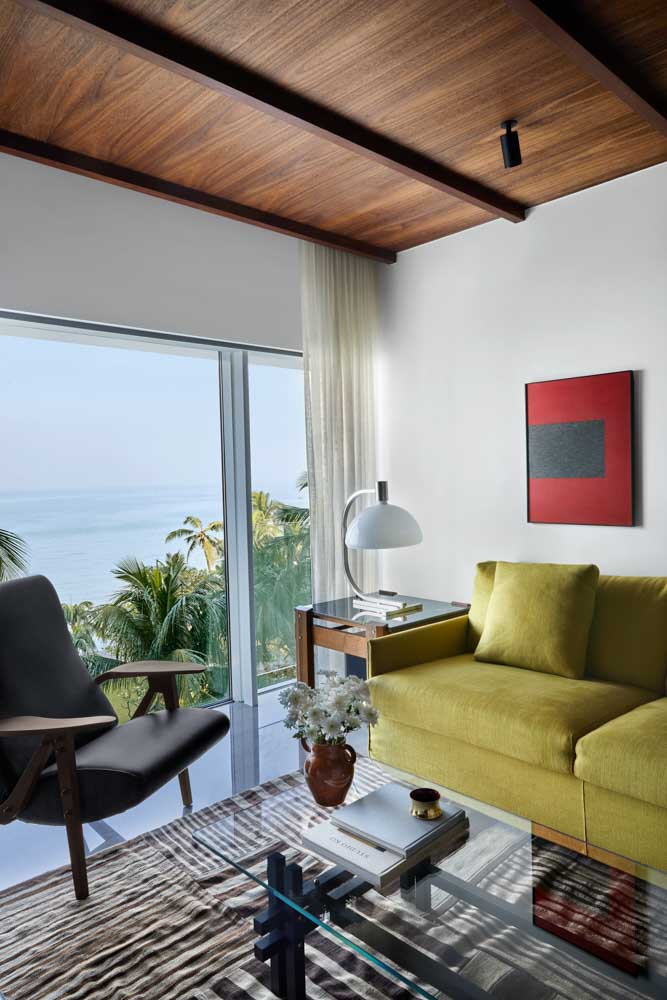 Gilda chair by Carlo Mollino with the linen-covered sofa & custom coffee table - Beautiful Homes