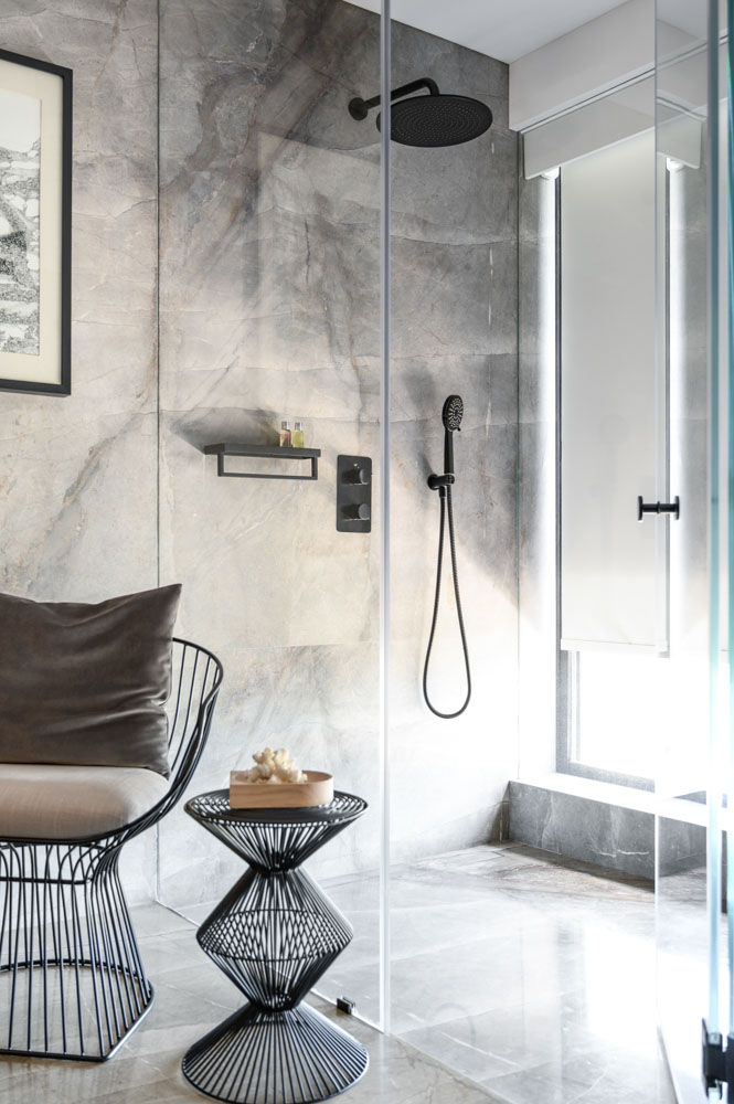 Grey shade finishes in shower area enhances bathroom design & decor - Beautiful Homes