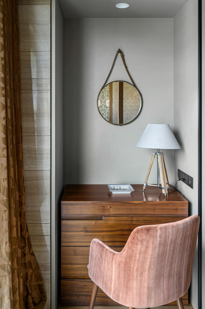 Niche in the wall is made like a vanity which doubles as a makeshift desk - Beautiful Homes