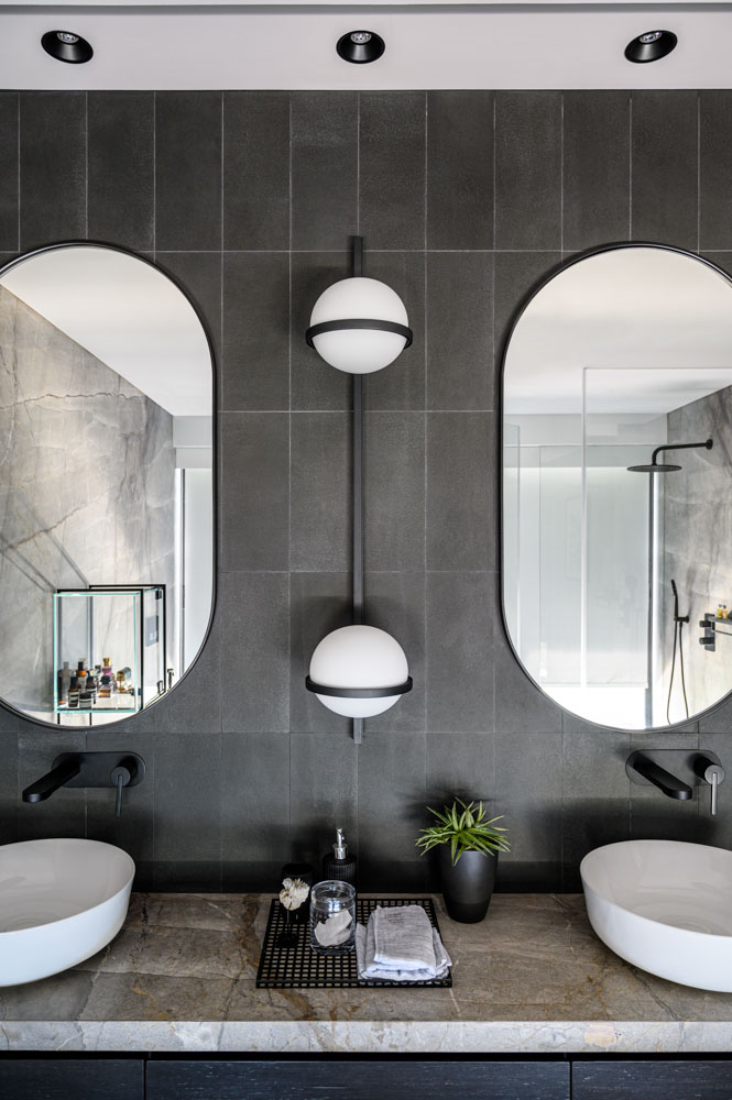 Bathroom interior design has monochrome palette with clean geometric lines - Beautiful Homes