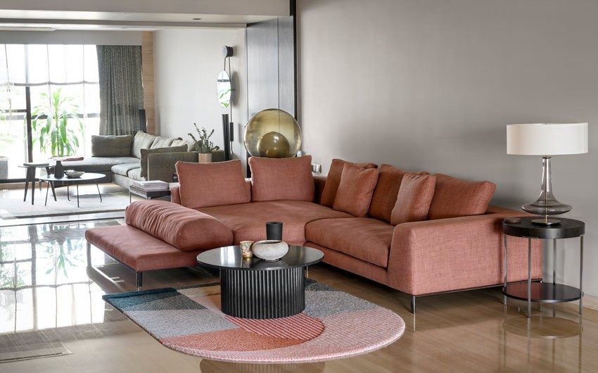Spacious & airy living room with a unique coffee table that has marble countertop - Beautiful Homes