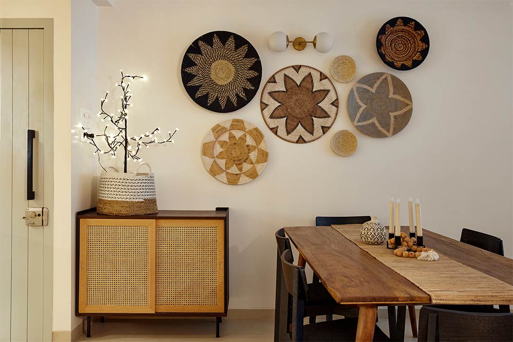 Dining room décor with wall plates & wooden dining table - Beautiful Homes