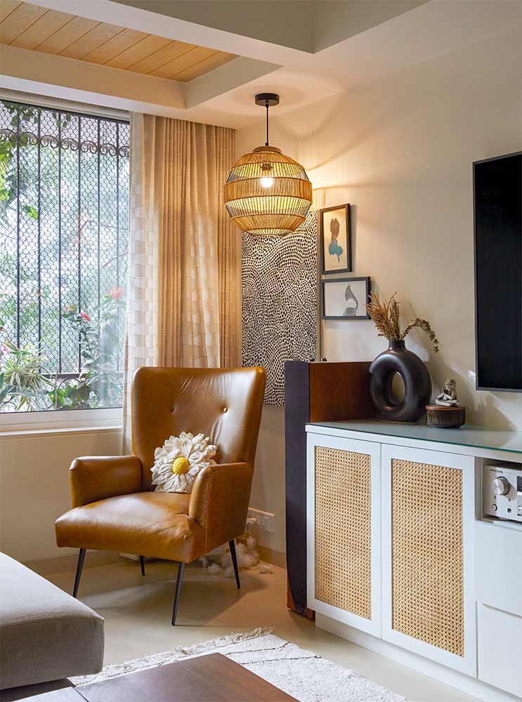 Sofa chair & hanging lights at the living room corner - Beautiful Homes