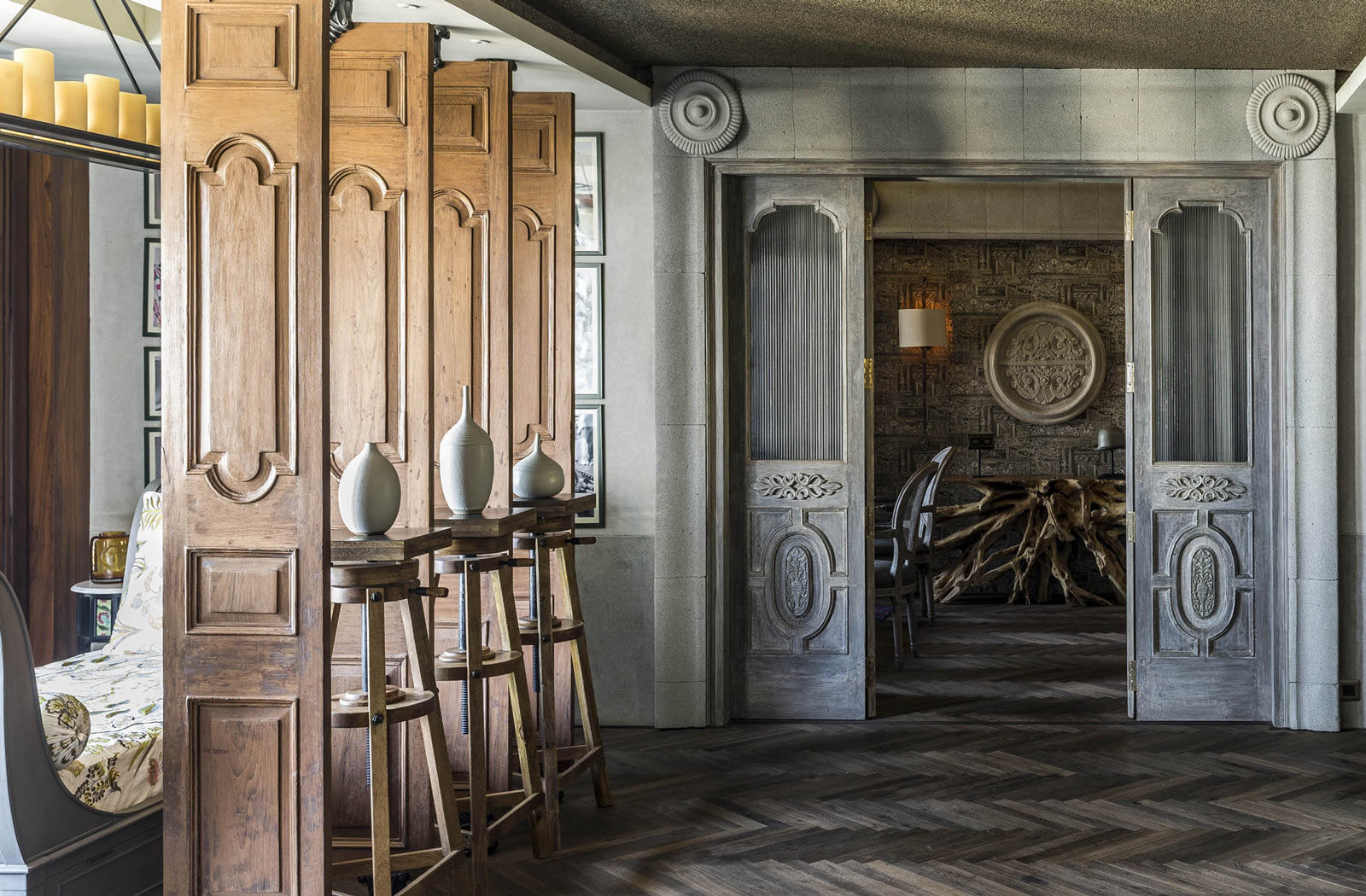 The section of the living room leading upto the family den features reclaimed doors - Beautiful Homes