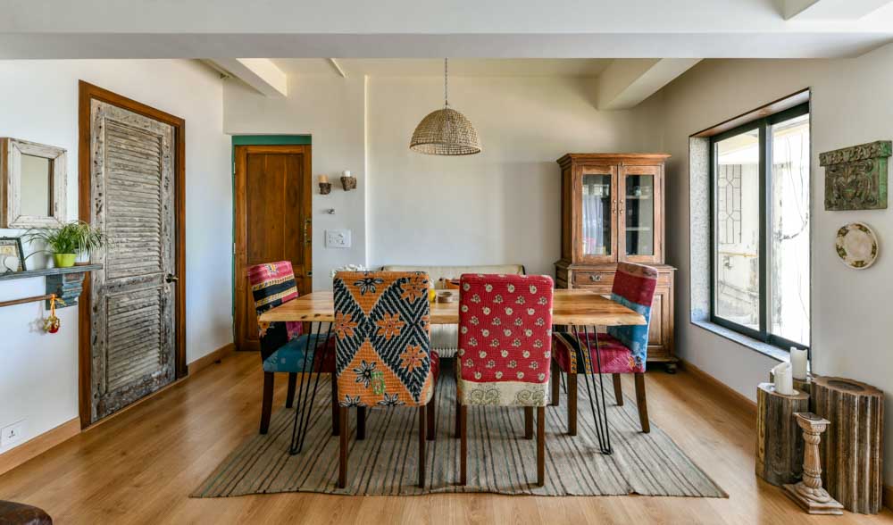 Dining room with a rustic furniture upholstered with hand quilted fabric - Beautiful Homes