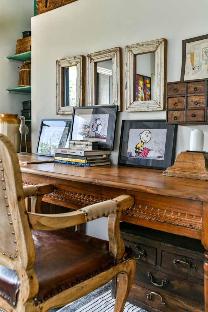 Work desk with rustic frames & paintings for home aesthetics - Beautiful Homes