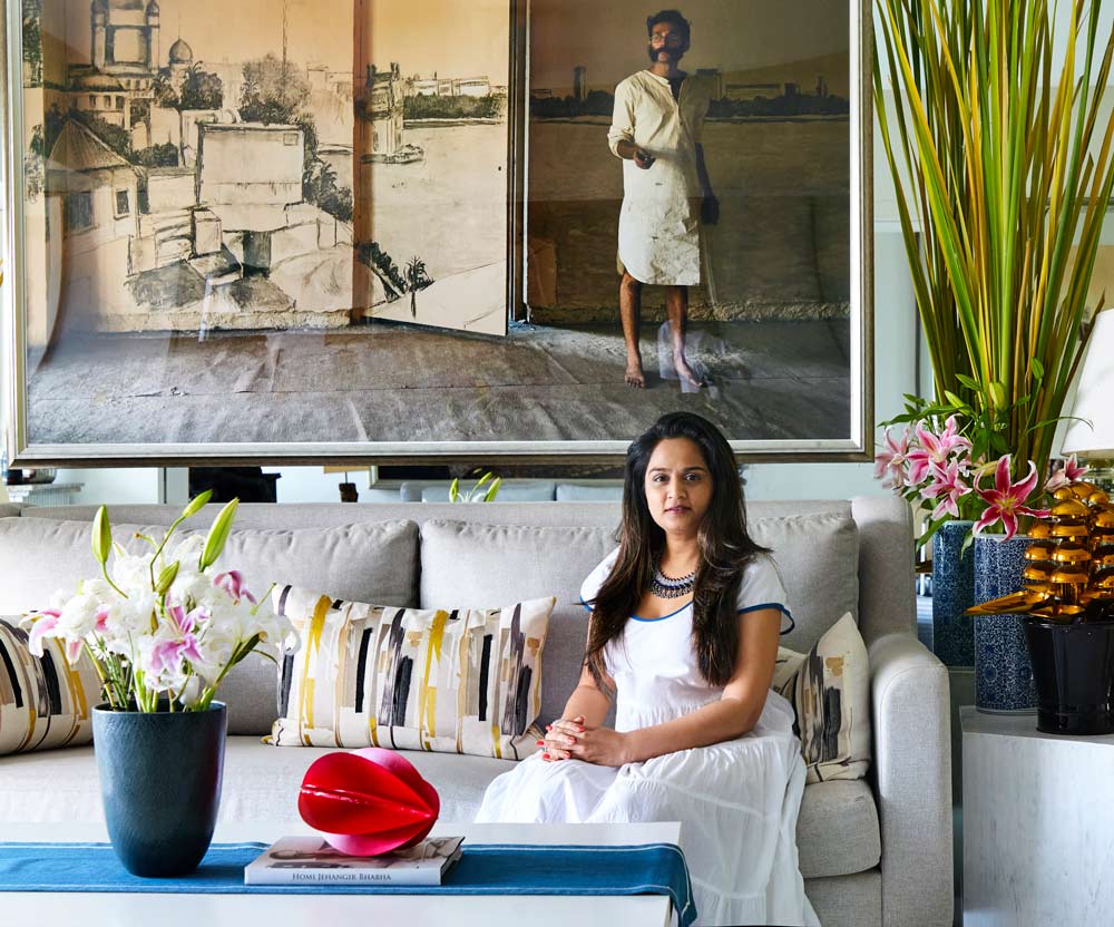 Saloni Doshi Sitting At Her Home on a Grey Sofa - Beautiful Homes 