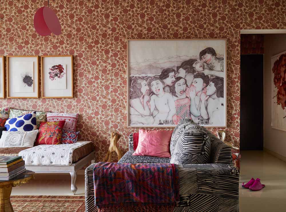 Room design has designer wallpaper, huge wall art & tea plant branch as home décor items - Beautiful Homes