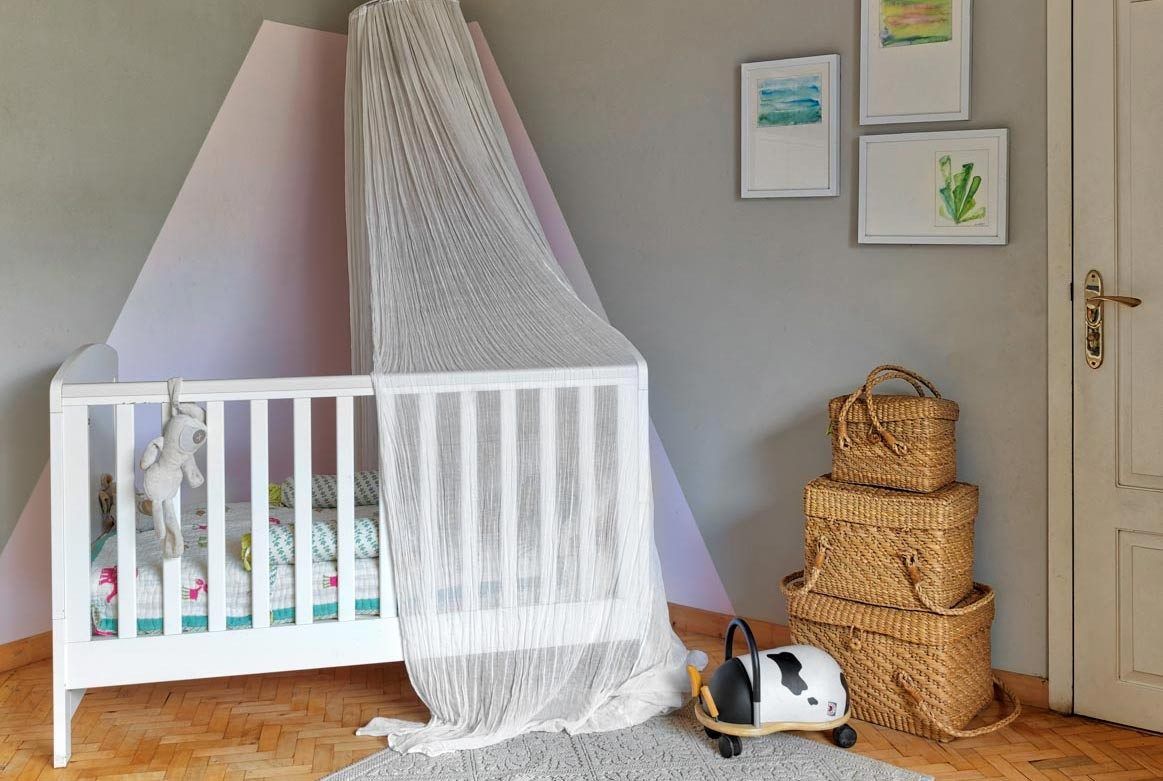 Nursery with white crib and little décor - Beautiful Homes