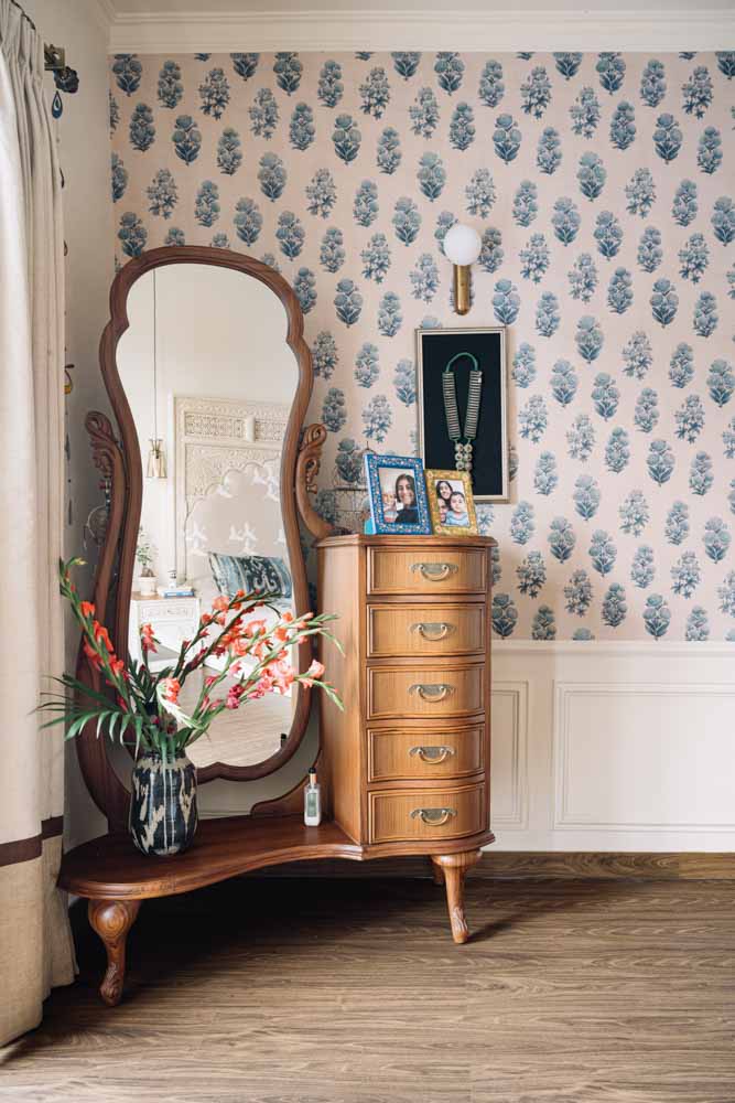 This wooden dressing table is custom made & the wallpaper is from Sabyasachi for Nilaya - Beautiful Homes