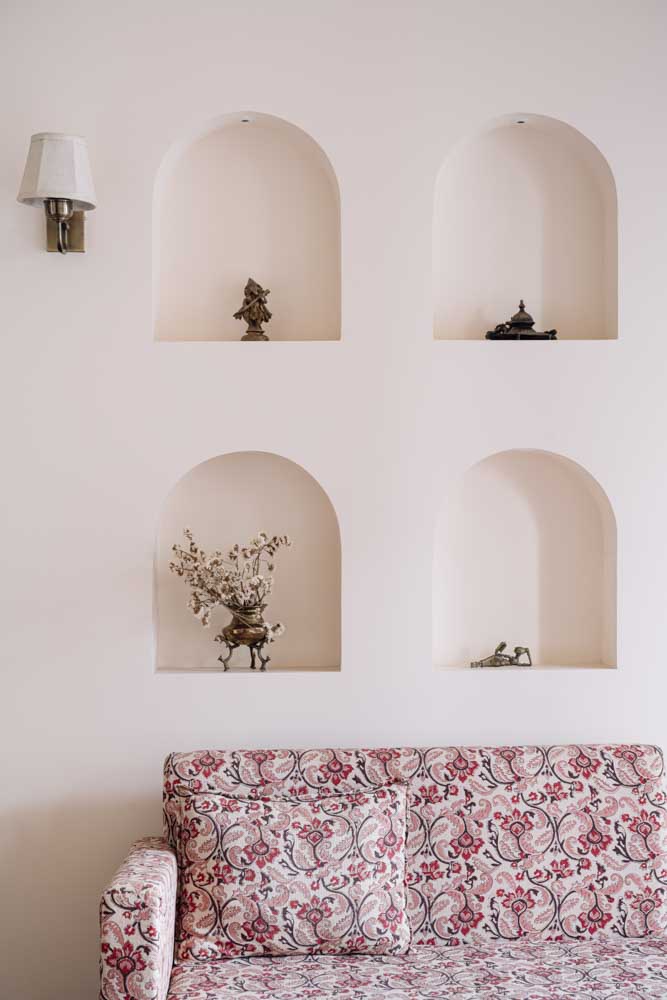 The wall niches has bronze accessories from Rajasthani places - Beautiful Homes
