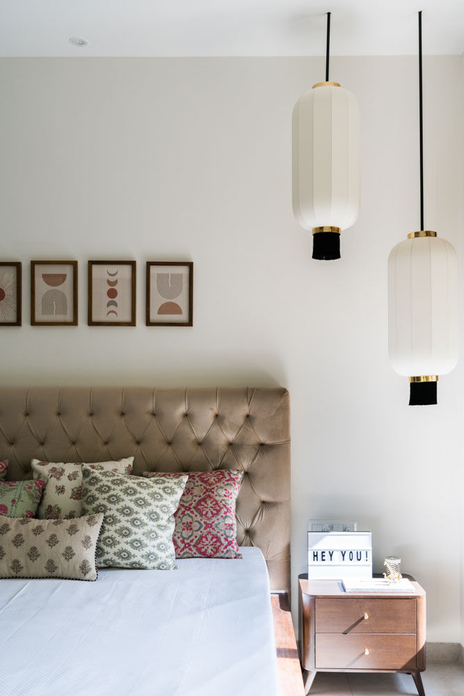 Headboard design with colourful cushion covers & hanging lights for daughters bedroom - Beautiful Homes